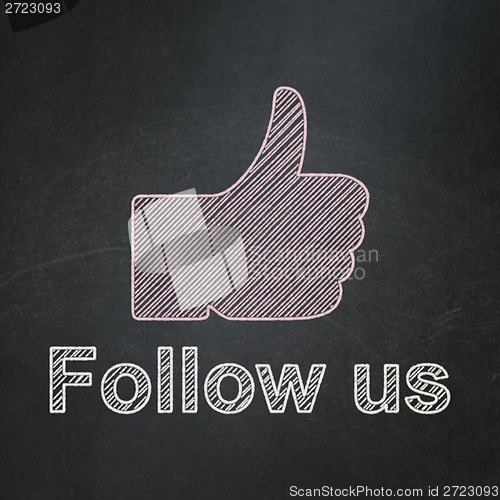 Image of Social media concept: Thumb Up and Follow us on chalkboard