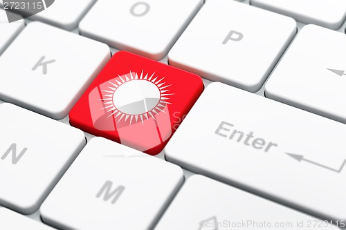 Image of Tourism concept: Sun on computer keyboard background