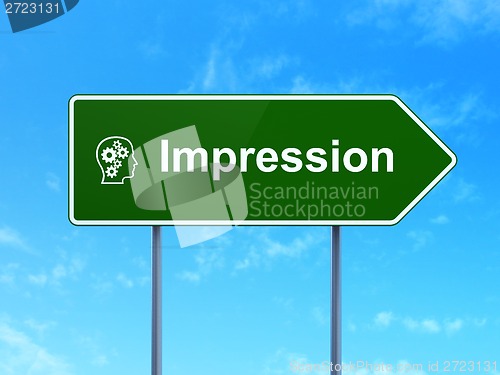 Image of Marketing concept: Impression and Head With Gears on road sign