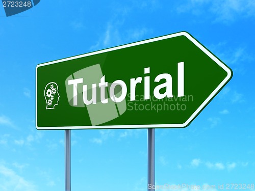 Image of Education concept: Tutorial and Head With Gears on road sign background