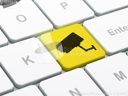 Image of Security concept: Cctv Camera on computer keyboard background