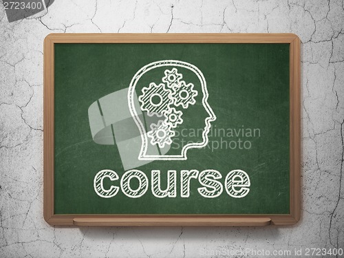 Image of Education concept: Head With Gears and Course on chalkboard background