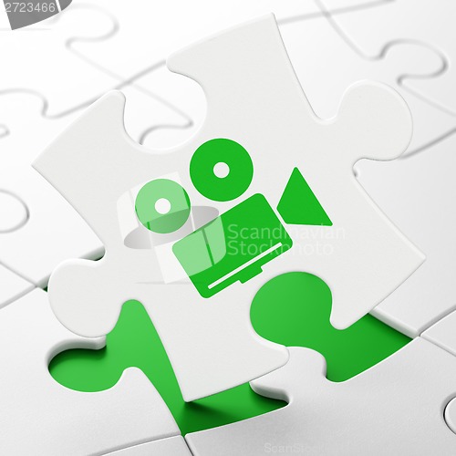 Image of Tourism concept: Camera on puzzle background