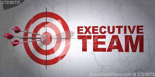 Image of Business concept: target and Executive Team on wall background