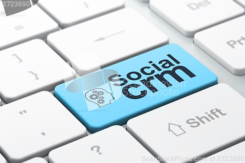 Image of Business business concept: Head With Gears and Social CRM on computer keyboard background