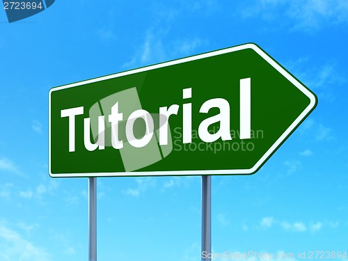 Image of Education concept: Tutorial on road sign background