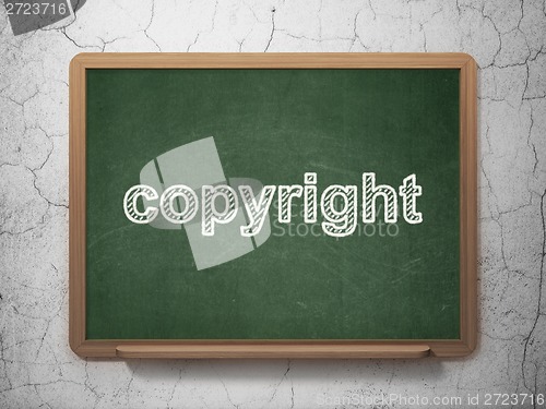 Image of Law concept: Copyright on chalkboard background