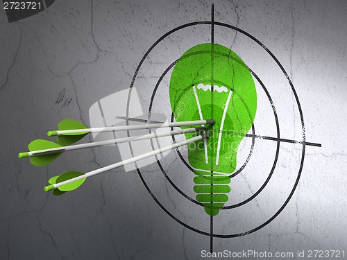 Image of Finance concept: arrows in Light Bulb target on wall background