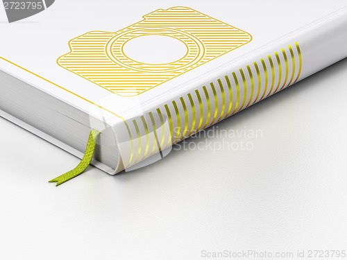 Image of Travel concept: closed book, Photo Camera on white background