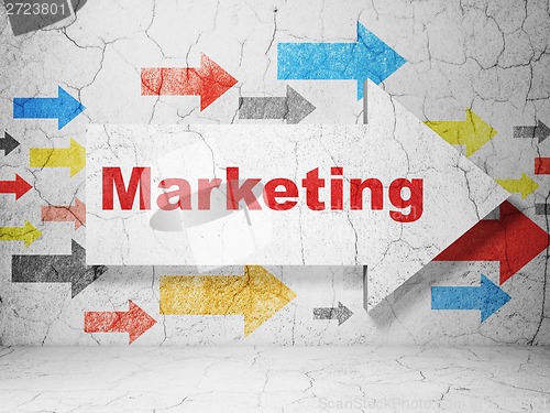 Image of Advertising concept: arrow with Marketing on grunge wall background