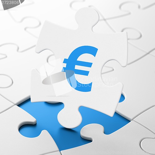 Image of Currency concept: Euro on puzzle background