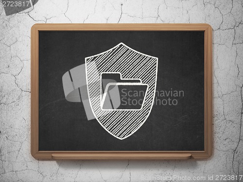 Image of Finance concept: Folder With Shield on chalkboard background