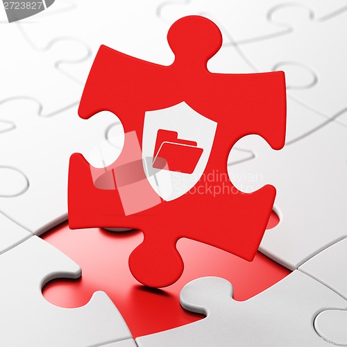 Image of Business concept: Folder With Shield on puzzle background