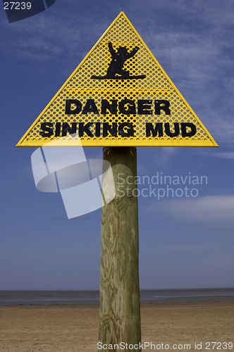 Image of Danger sinking mud sign, sand point beach England uk