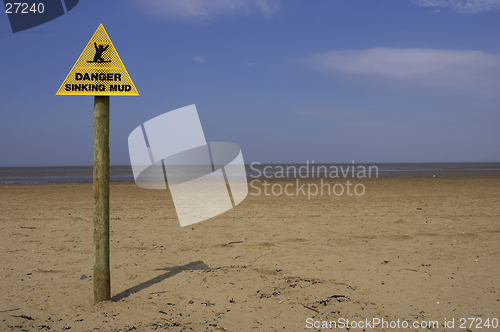 Image of Danger sinking mud sign, sand point beach England uk