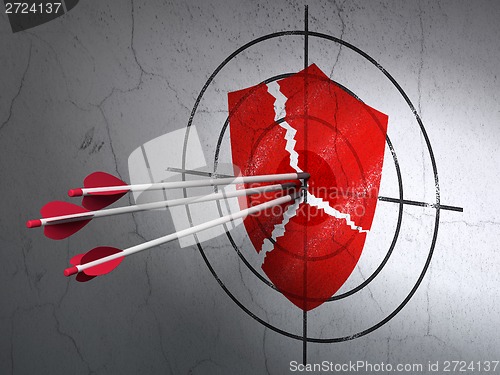 Image of Safety concept: arrows in Broken Shield target on wall background