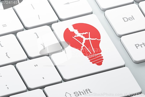 Image of Finance concept: Light Bulb on computer keyboard background