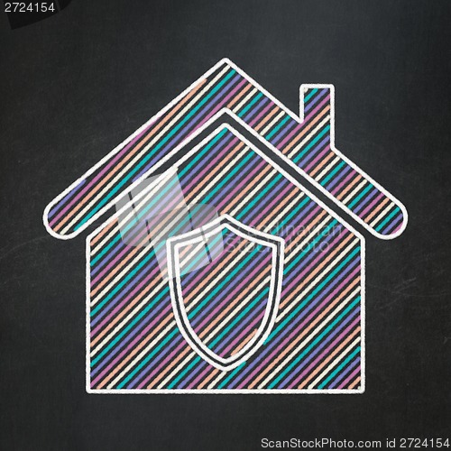 Image of Finance concept: Home on chalkboard background
