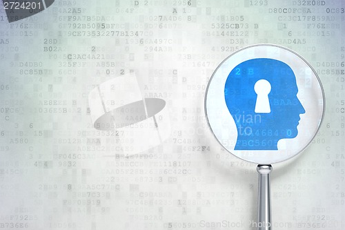 Image of Data concept:  Head With Keyhole optical glass on digital background
