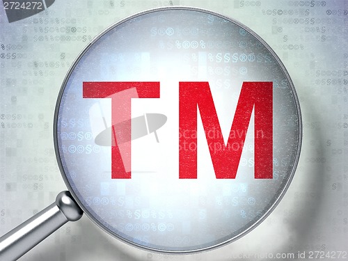 Image of Law concept: Trademark with optical glass on digital background