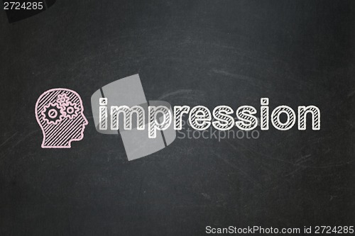 Image of Advertising concept: Head With Gears and Impression on chalkboard background