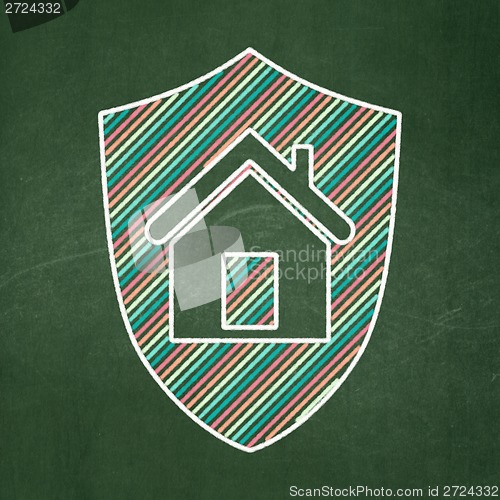 Image of Business concept: Shield on chalkboard background