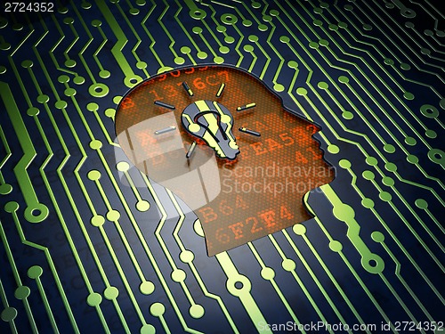Image of Finance concept: Head With Light Bulb on circuit board background