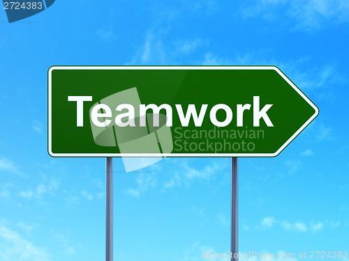 Image of Finance concept: Teamwork on road sign background