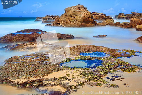 Image of Long exposure rocks and rock pools at low tide