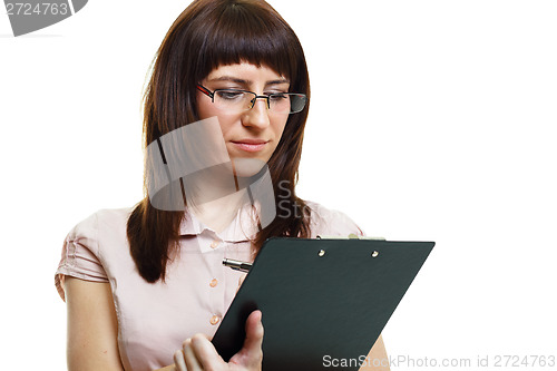 Image of young beautiful woman in glasses with a pen and documents