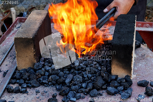 Image of blacksmith furnace with burning coals 