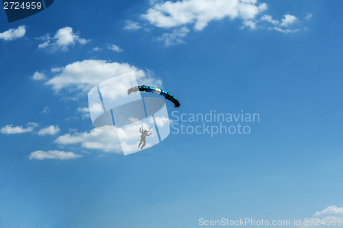 Image of unidentified skydiver on blue sky