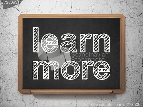 Image of Education concept: Learn More on chalkboard background