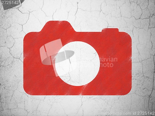 Image of Vacation concept: Photo Camera on wall background