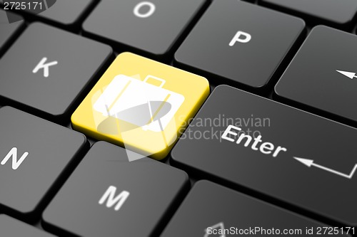 Image of Travel concept: Bag on computer keyboard background