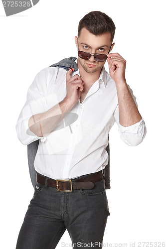 Image of Businessman peering over the rim of sunglasses