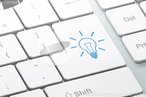 Image of Business concept: Light Bulb on computer keyboard background