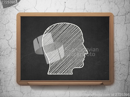 Image of Advertising concept: Head on chalkboard background