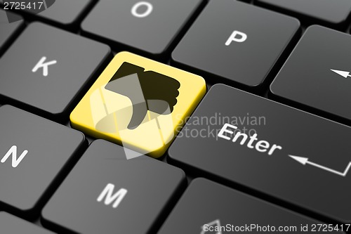 Image of Social network concept: Thumb Down on computer keyboard background