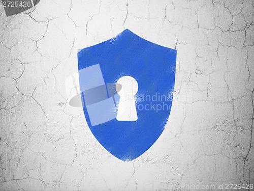 Image of Privacy concept: Shield With Keyhole on wall background