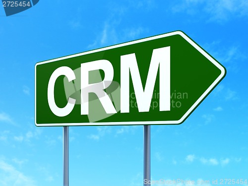 Image of Finance concept: CRM on road sign background