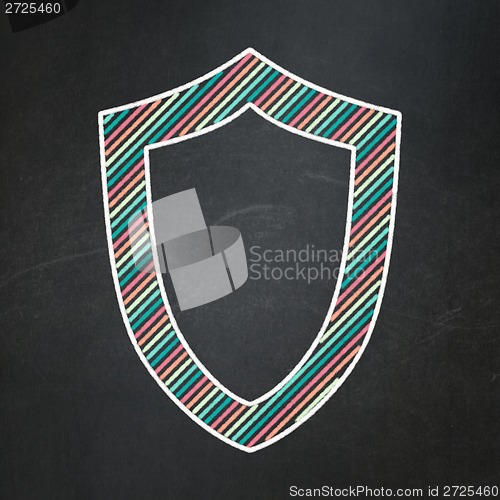 Image of Protection concept: Contoured Shield on chalkboard background