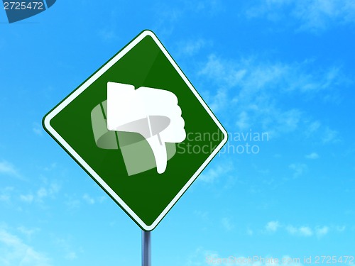 Image of Social media concept: Thumb Down on road sign background