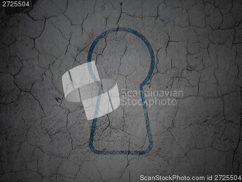 Image of Privacy concept: Keyhole on grunge wall background