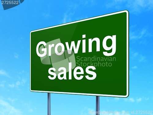 Image of Finance concept: Growing Sales on road sign background