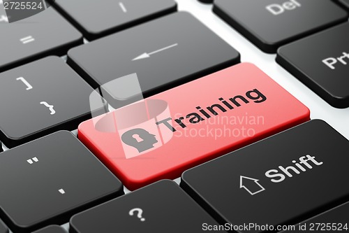 Image of Education concept: Head With Keyhole and Training on keyboard
