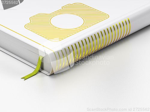 Image of Tourism concept: closed book, Photo Camera on white background