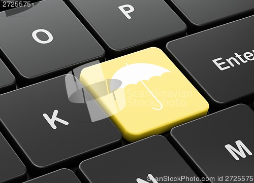 Image of Privacy concept: Umbrella on computer keyboard background