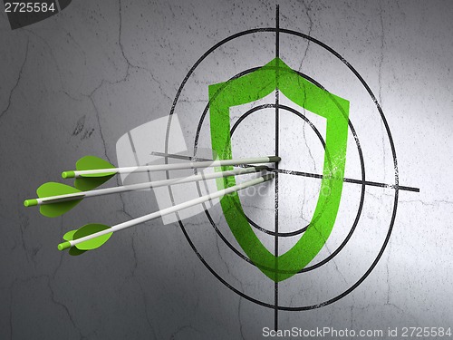 Image of Privacy concept: arrows in Contoured Shield target on wall background