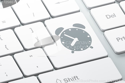 Image of Time concept: Alarm Clock on computer keyboard background
